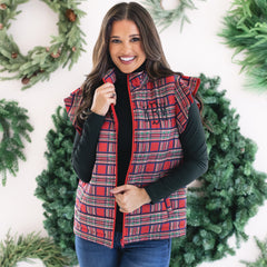 up close of girl wearing monogrammed quilted ruffle sleeve vest in red plaid 