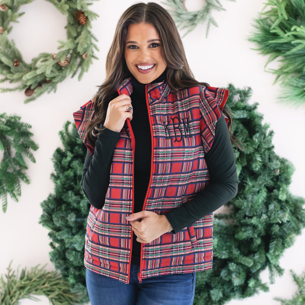 [peyton] up close of girl wearing monogrammed quilted ruffle sleeve vest in red plaid 