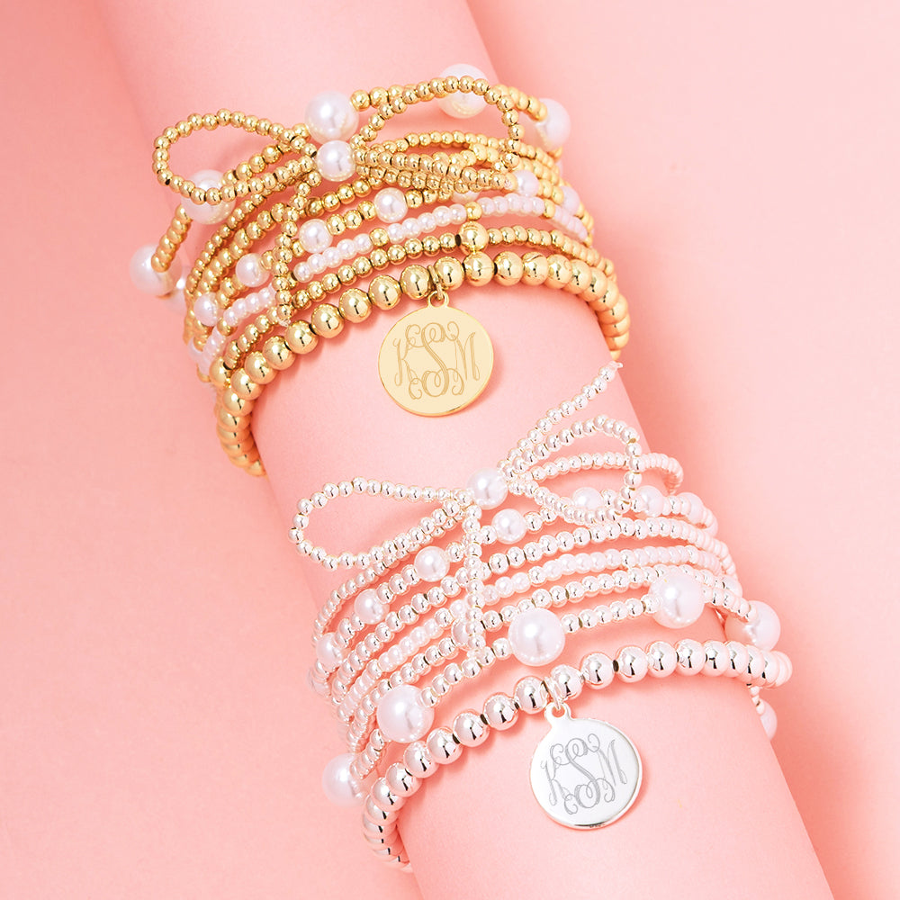 duo pearl bow bracelet stack in gold and silver