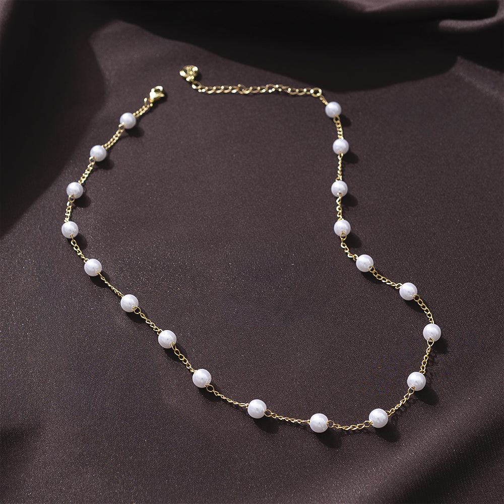 pearl  station  necklace  on  brown  satin