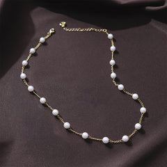 pearl  station  necklace  on  brown  satin