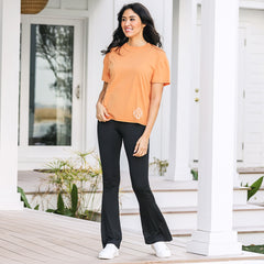 orange comfy tee with crossover black flare leggings