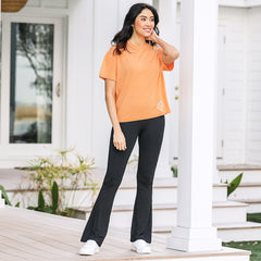 crossover leggings in black with orange tee