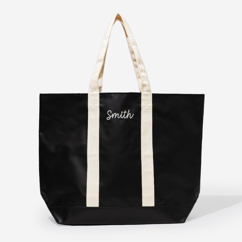 monogrammed waterproof tote in black sp26