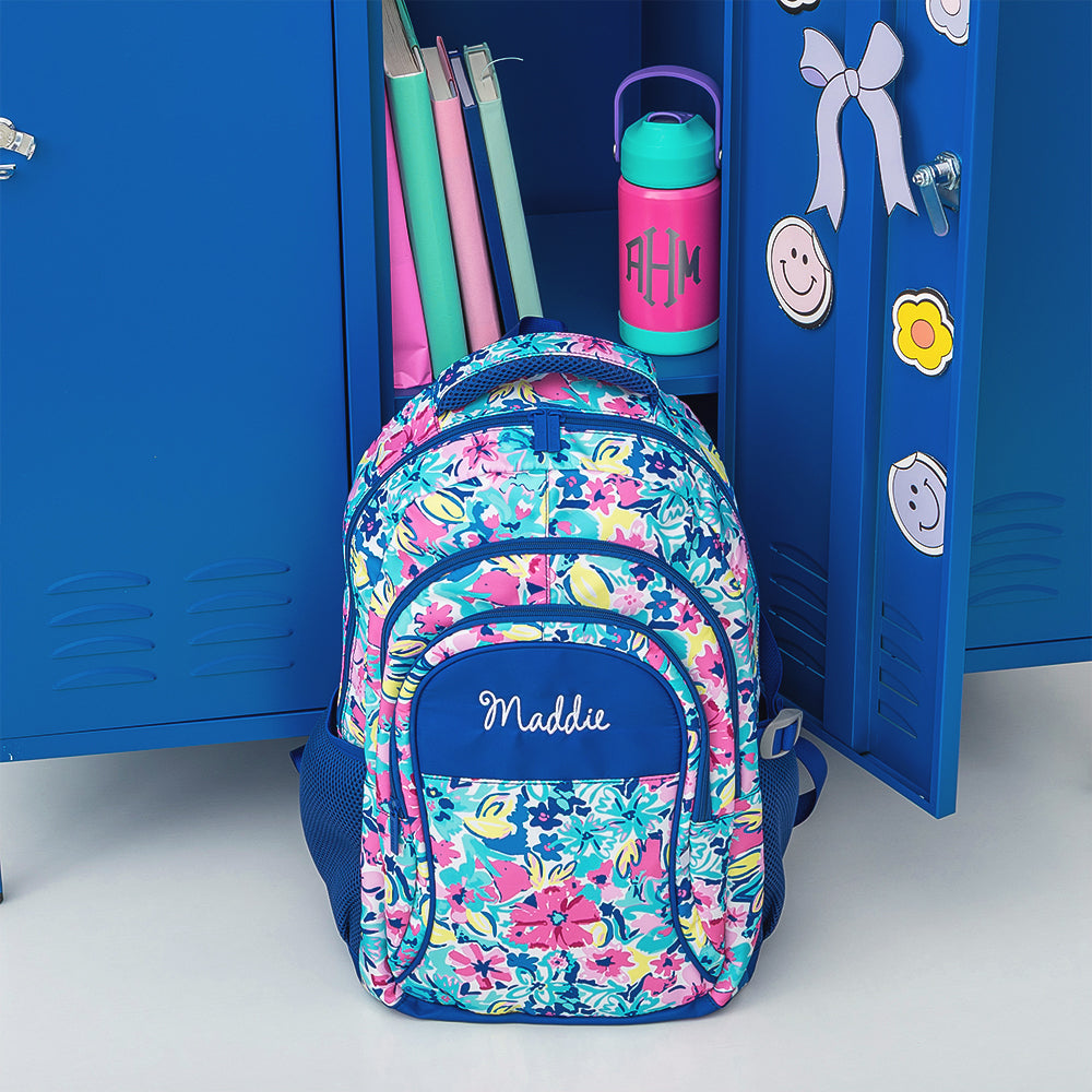 watercolor whimsy backpack lean against lockers 