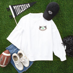 white bow football sweatshirt flatlay