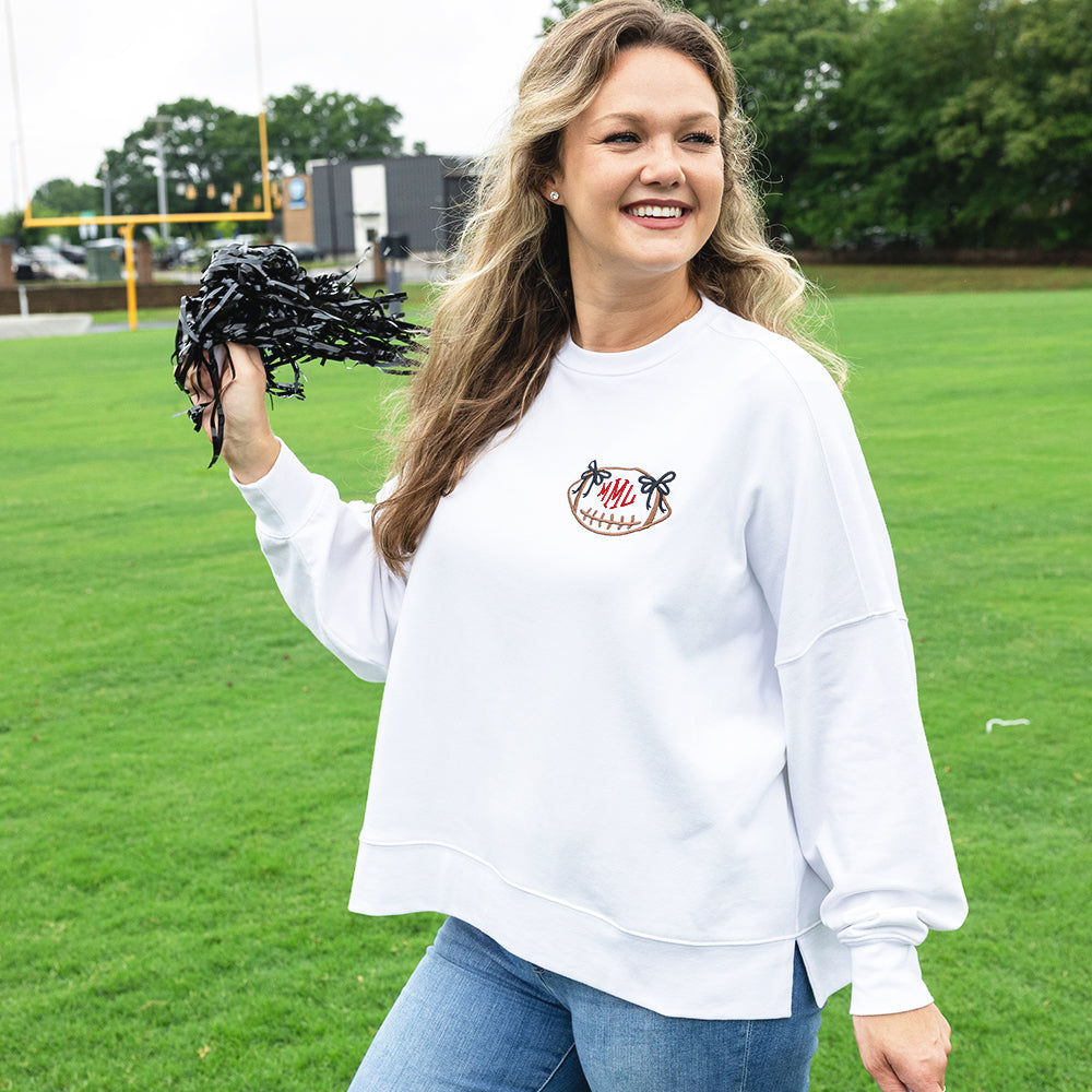 white bow football sweatshirt on emily