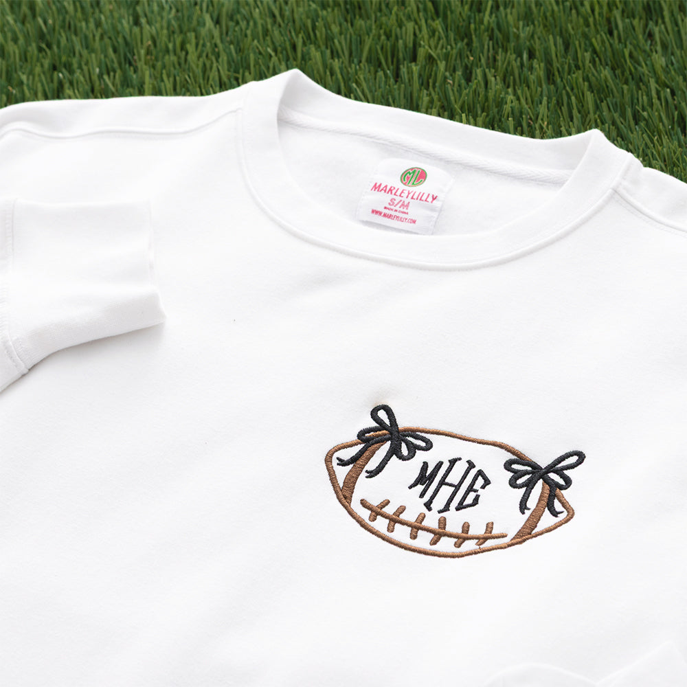 white bow football sweatshirt up close