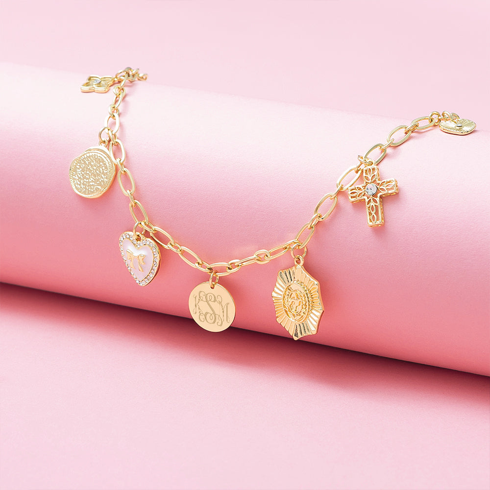 white gold charm necklace on pink