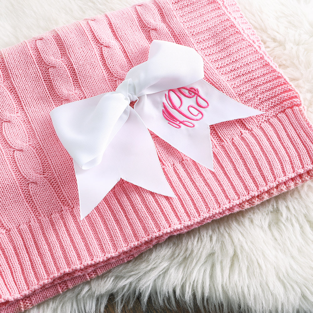 white hair bow on pink personalized blanket