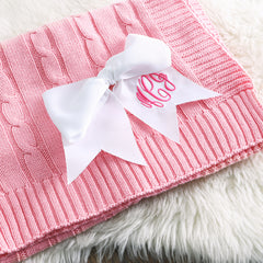 white hair bow on pink personalized blanket