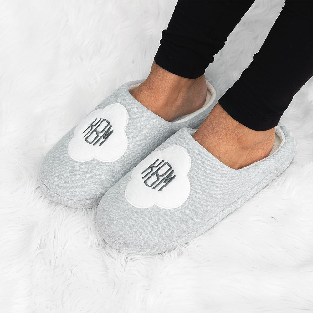 white quatrefoil slippers on girl
