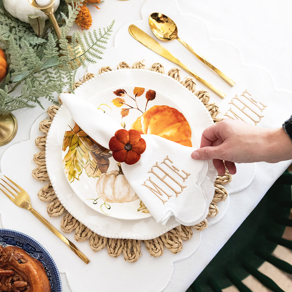 white scalloped napkin with fall decor