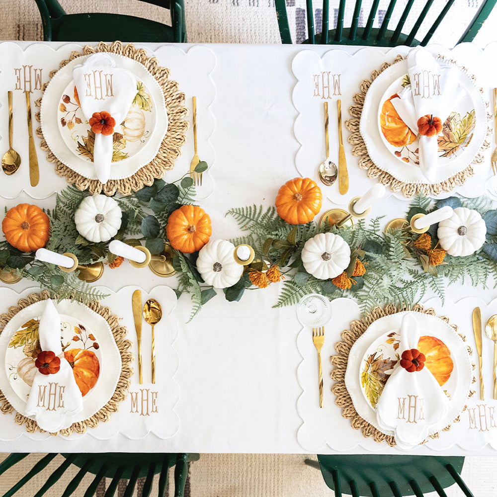 white scalloped napkins and placemats  table setting