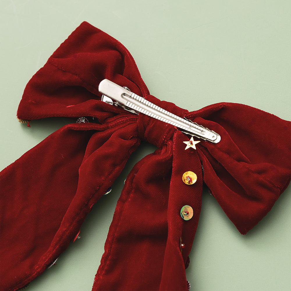 back of christmas velvet bow on green