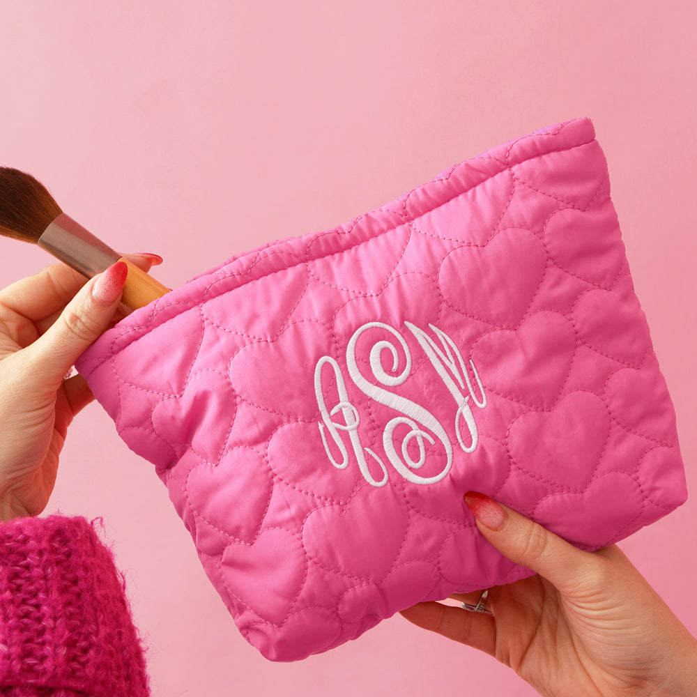 hand held heart cosmetic bag with makeup brush