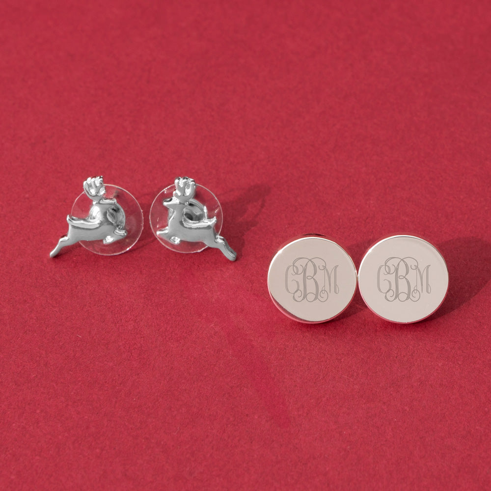 Reindeer earrings on red background