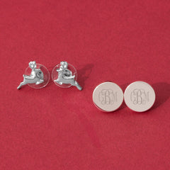 Reindeer earrings on red background