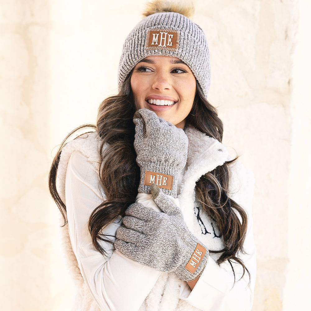 girl wearing heathered brown monogrammed beanie and gloves 