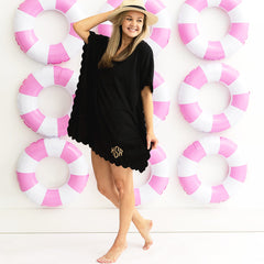 girl in black bathing suit cover over pool rings