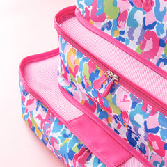 watercolor cheetah packing bag set stacked up close