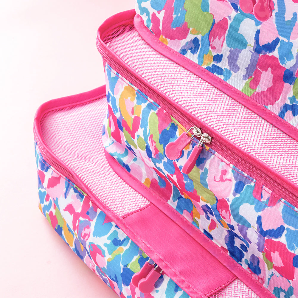 watercolor cheetah packing bag set stacked up close